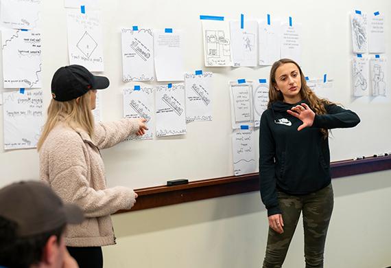 Image of students pitching an app in class