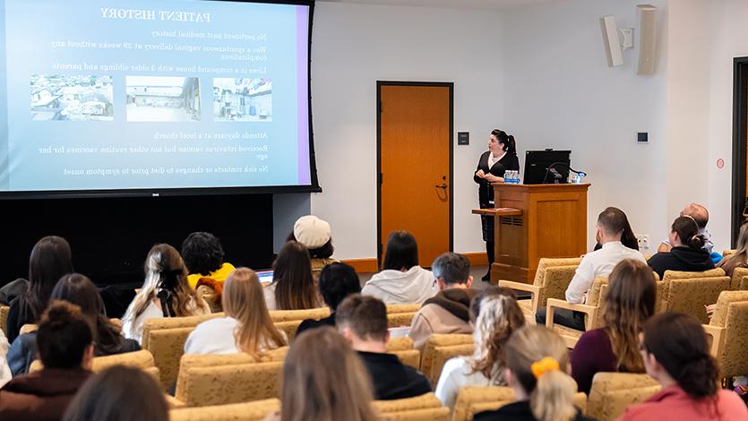 Image of Caitlin Conner presenting her experience and research findings at the Murray Student Center after returning to Marist’s Poughkeepsie campus.